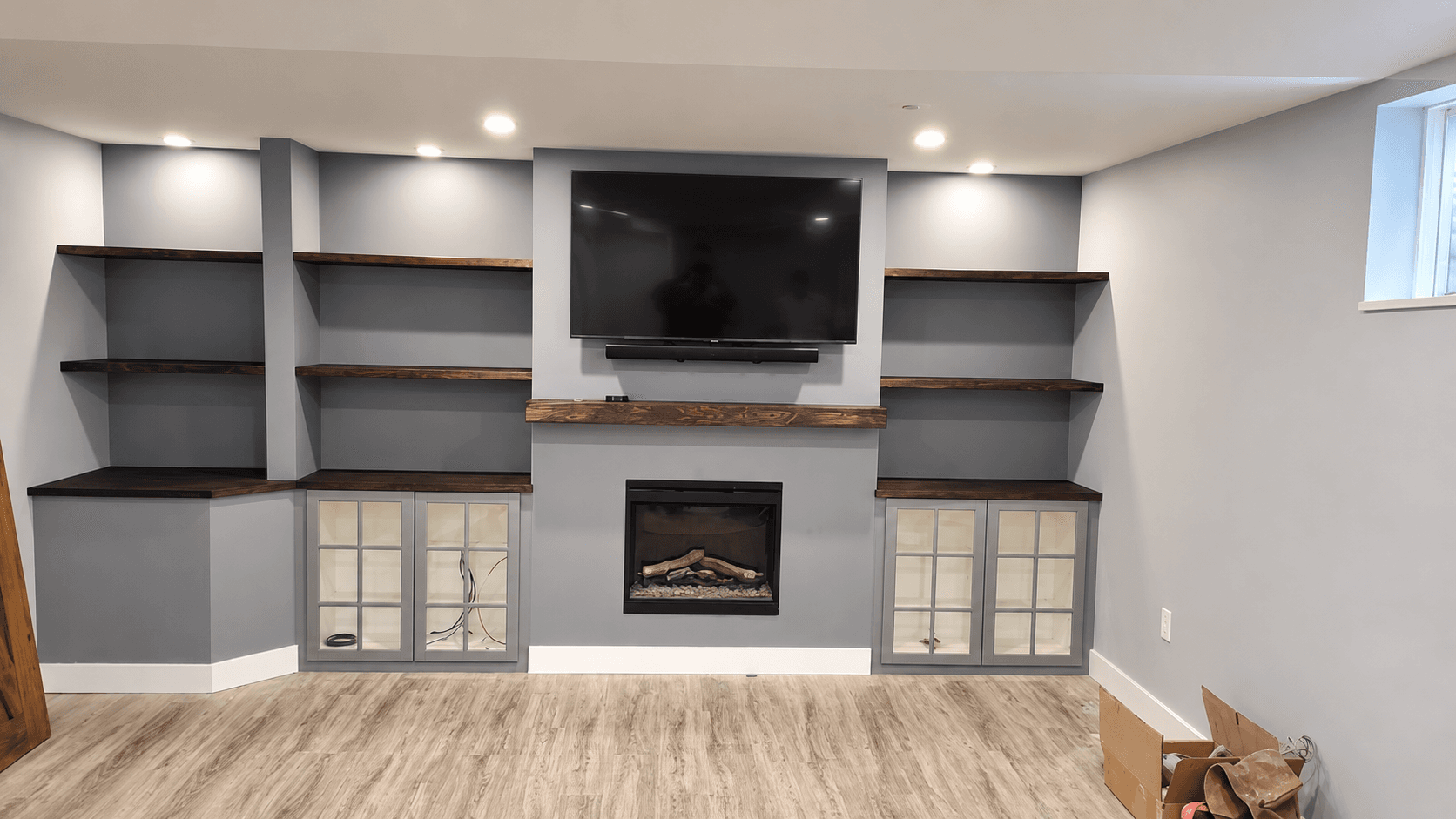 Fireplace, built-in shelving and painted walls in a living space